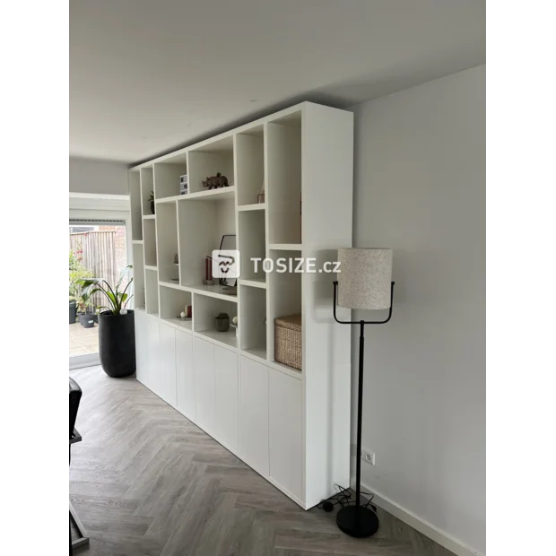 White cupboard wall with open compartments and doors