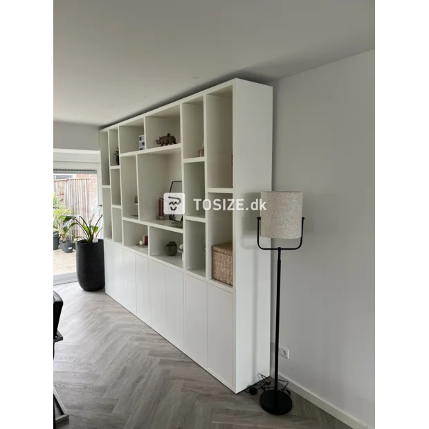 White cupboard wall with open compartments and doors