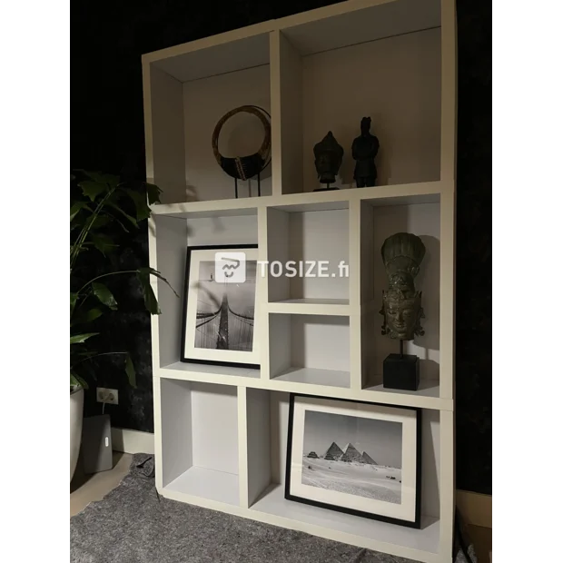 White shelving unit with open compartments and shelves