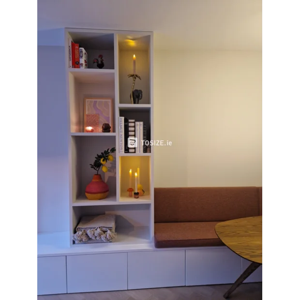 White shelving unit with open compartments and shelves