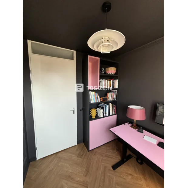 Pink bookcase with open compartments and doors