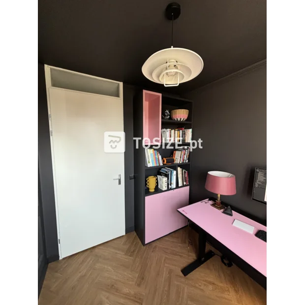 Pink bookcase with open compartments and doors