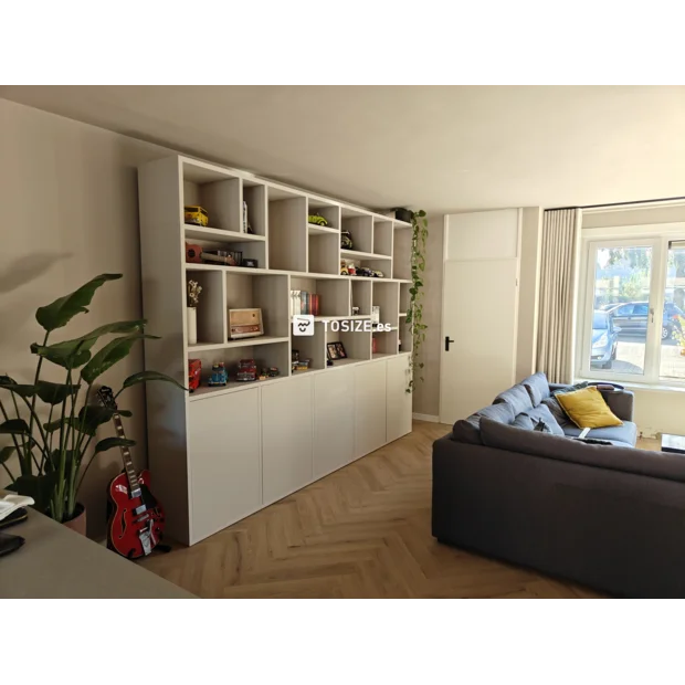 White cupboard wall with open compartments and doors