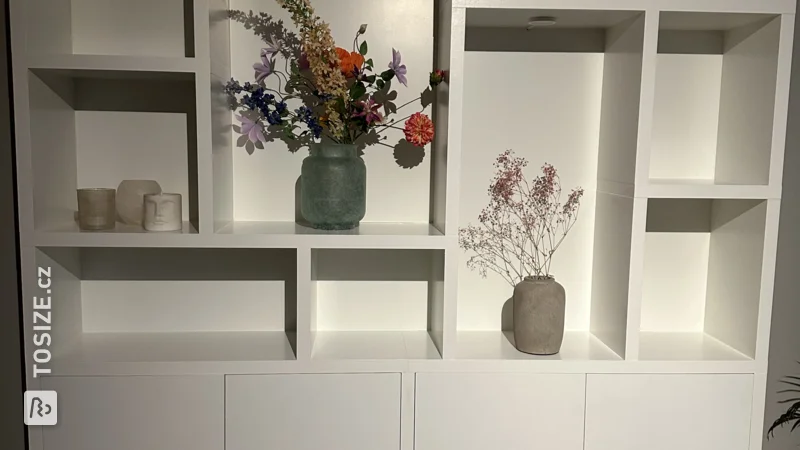 Custom-made white shelving unit, by Daphne