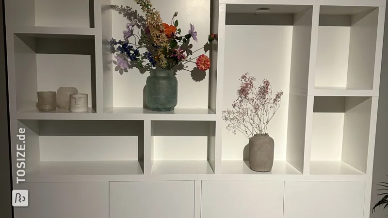 Custom-made white shelving unit, by Daphne