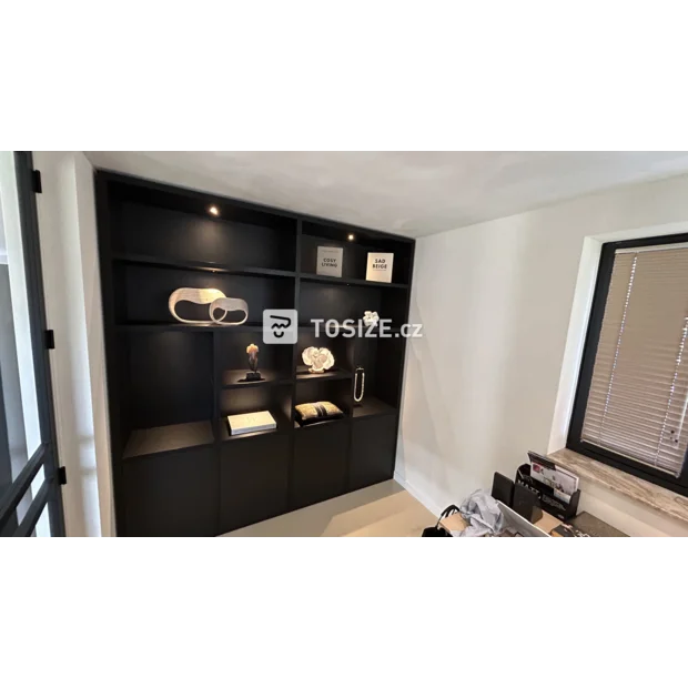 Black cupboard wall with open compartments and doors