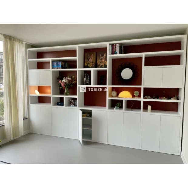 White cupboard wall with open compartments and doors