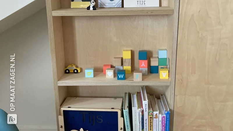 Custom bookcase for chimney pipe made of birch plywood, by Leonoor