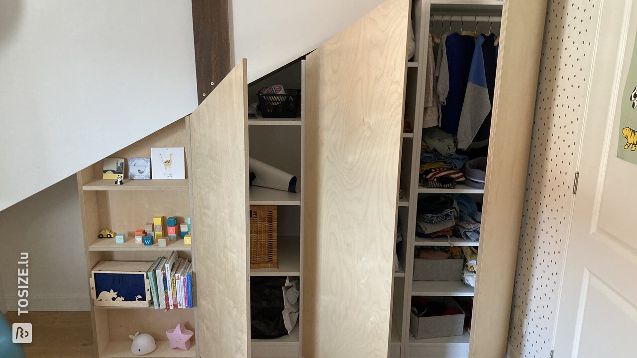 Bespoke plywood birch cupboard doors for PAX cupboard under sloping roof, by Leonoor