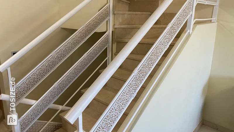 Railing decoration using white lacquered MDF panels with carvings of different textures