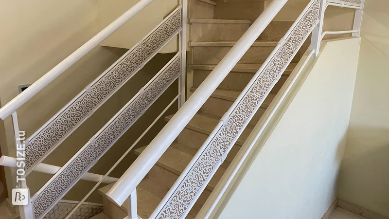 Railing decoration using white lacquered MDF panels with carvings of different textures