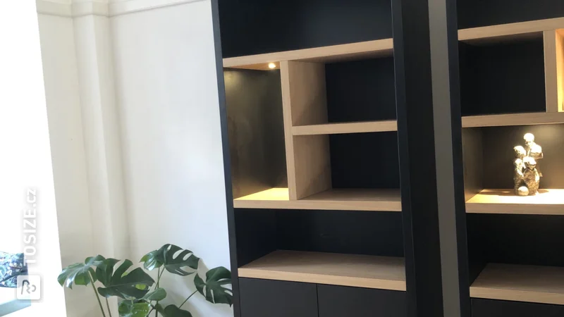 Black custom bookcase with oak beams, by Hans