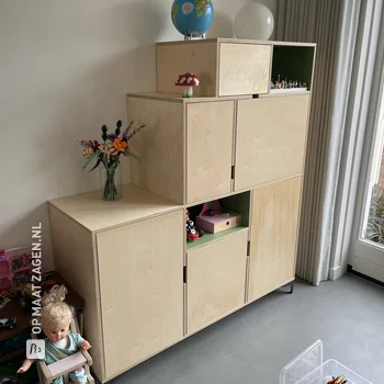 Unique toy cabinet with doors and open compartments made of plywood, by Niels