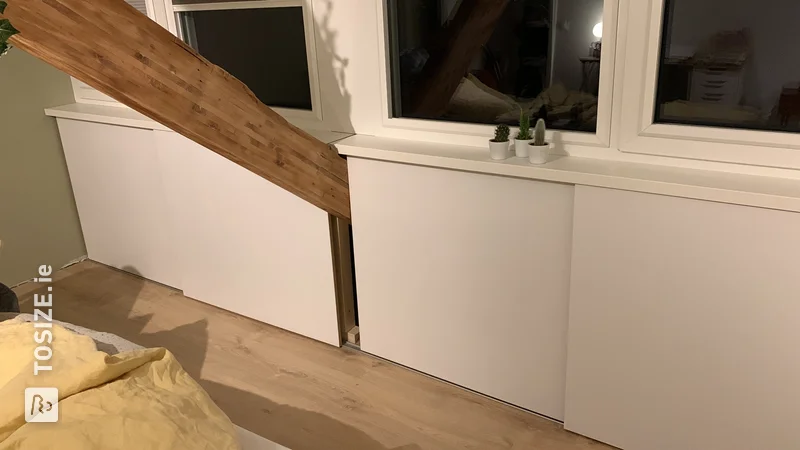 Homemade white knee wall shed from MDF, by Eric